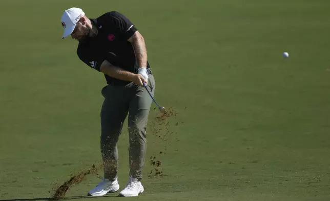 Tyrell Hatton of England plays his second shot on the 2nd hole during the second round of World Tour Golf Championship in Dubai, United Arab Emirates, Saturday, Nov. 16, 2024. (AP Photo/Altaf Qadri)