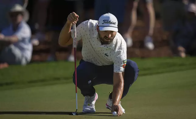 Antoine Rozner of France lines up a putt on the 8th green during the second round of World Tour Golf Championship in Dubai, United Arab Emirates, Saturday, Nov. 16, 2024. (AP Photo/Altaf Qadri)