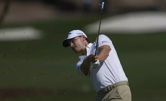 Rasmus Højgaard of Denmark plays his second shot on the 2nd hole during the second round of World Tour Golf Championship in Dubai, United Arab Emirates, Saturday, Nov. 16, 2024. (AP Photo/Altaf Qadri)