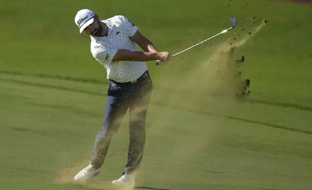 Antoine Rozner of France plays his second shot on the 9th hole during the second round of World Tour Golf Championship in Dubai, United Arab Emirates, Saturday, Nov. 16, 2024. (AP Photo/Altaf Qadri)