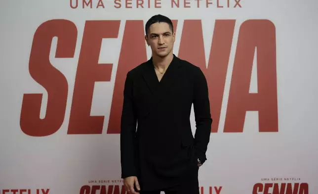 Brazilian actor Gabriel Leone poses for photos on the red carpet for the Netflix series Senna, about the life and death of Formula 1 legend Ayrton Senna, who was killed in 1994 in a crash, in Sao Paulo, Tuesday, Nov. 26, 2024. (AP Photo/Andre Penner)