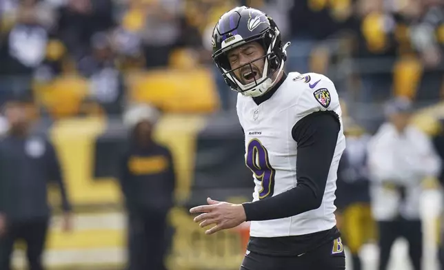 Baltimore Ravens kicker Justin Tucker reacts after missing a second field goal attempt against the Pittsburgh Steelers during the first half of an NFL football game, Sunday, Nov. 17, 2024, in Pittsburgh. (AP Photo/Matt Freed)