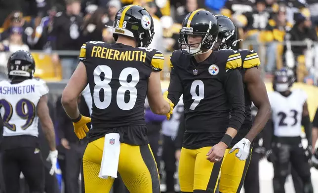 Pittsburgh Steelers kicker Chris Boswell (9) reacts with teammate Pat Freiermuth (88) after kicking a field goal against the Baltimore Ravens during the first half of an NFL football game, Sunday, Nov. 17, 2024, in Pittsburgh. (AP Photo/Gene J. Puskar)