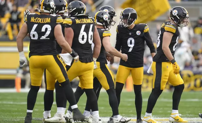 Pittsburgh Steelers kicker Chris Boswell (9) is congratulated by teammates after kicking a field goal against the Baltimore Ravens during the second half of an NFL football game, Sunday, Nov. 17, 2024, in Pittsburgh. (AP Photo/Gene J. Puskar)