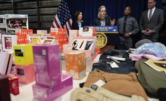 Queens District Attorney Melinda Katz speaks, as New York Gov. Kathy Hochul, New York State Police Superintendent Steven James and Homeland Security Investigations New York Special Agent in Charge William S. Walker looks on, at a press conference on an international stolen merchandise ring, Tuesday, Nov. 26, 2024, in the Queens borough of New York. (AP Photo/Julia Demaree Nikhinson)