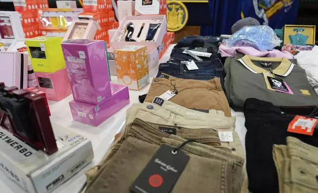 Stolen merchandise is displayed during a press conference on an international stolen merchandise ring, Tuesday, Nov. 26, 2024, in the Queens borough of New York. (AP Photo/Julia Demaree Nikhinson)