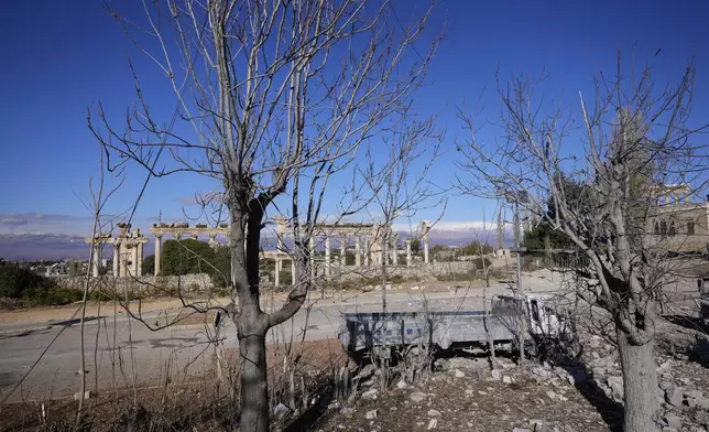 Damaged vehicles are seen in front of the Roman temples of Baalbek in eastern Lebanon, Thursday, Nov. 28, 2024. (AP Photo/Hassan Ammar)