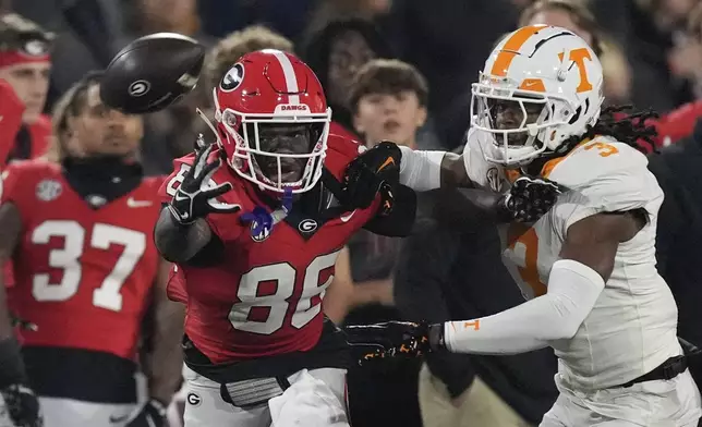 Georgia wide receiver Cole Speer (83) can not reach a pass as Tennessee defensive back Jermod McCoy (3) defends during the first half of an NCAA college football game, Saturday, Nov. 16, 2024, in Athens, Ga. (AP Photo/John Bazemore)