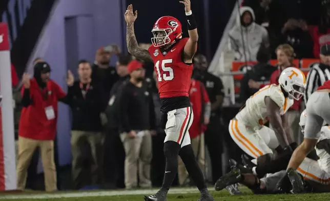 Georgia quarterback Carson Beck (15) reacts after a Georgia touchdown during the second half of an NCAA college football game against Tennessee, Saturday, Nov. 16, 2024, in Athens, Ga. (AP Photo/John Bazemore)