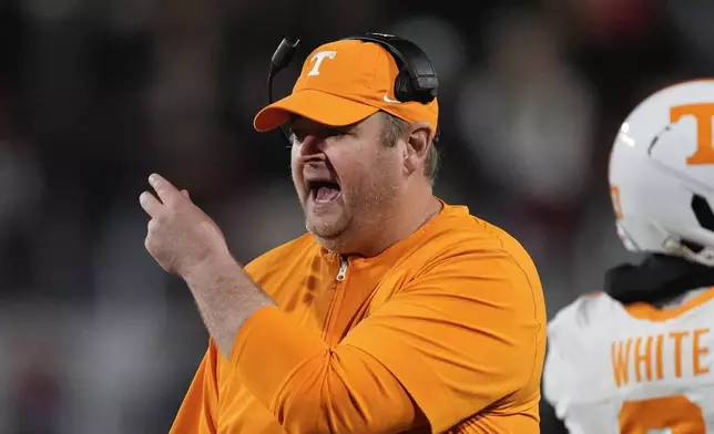 Tennessee head coach Josh Heupel yells to an official during the first half of an NCAA college football game against Georgia , Saturday, Nov. 16, 2024, in Athens, Ga. (AP Photo/John Bazemore)