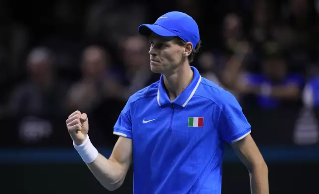 Italy's Jannik Sinner reacts winning a point as he plays Netherlands' Tallon Griekspoor during the Davis Cup final tennis match between Netherlands and Italy at the Martin Carpena Sports Hall in Malaga, southern Spain, Sunday, Nov. 24, 2024. (AP Photo/Manu Fernandez)