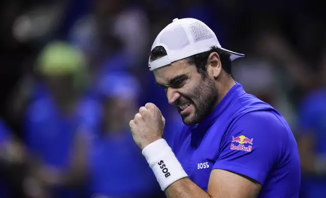 Italy's Matteo Berrettini celebrates a point against Netherlands' Botic van de Zandschulp during the Davis Cup final tennis match between Netherlands and Italy at the Martin Carpena Sports Hall in Malaga, southern Spain, on Sunday, Nov. 24, 2024. (AP Photo/Manu Fernandez)