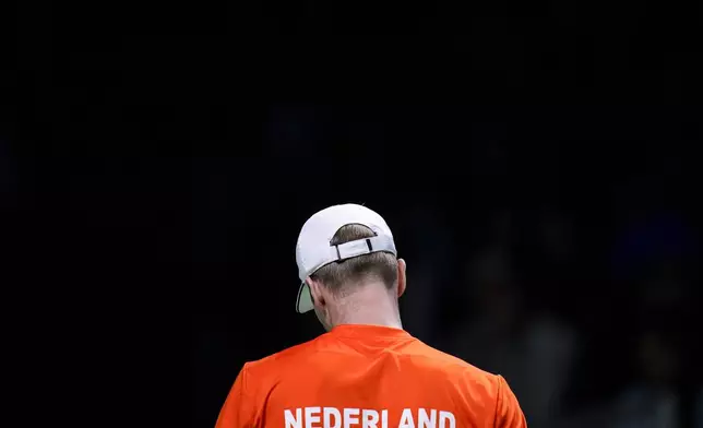 Netherlands' Botic van de Zandschulp reacts during his match against Italy's Matteo Berrettini during the Davis Cup final tennis match between Netherlands and Italy at the Martin Carpena Sports Hall in Malaga, southern Spain, on Sunday, Nov. 24, 2024. (AP Photo/Manu Fernandez)