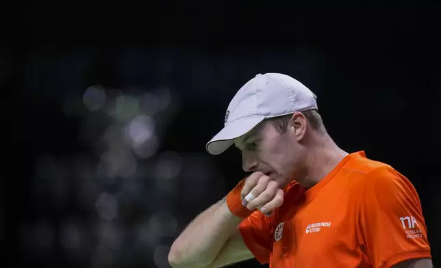 Netherlands' Botic van de Zandschulp reacts during his match against Italy's Matteo Berrettini during the Davis Cup final tennis match between Netherlands and Italy at the Martin Carpena Sports Hall in Malaga, southern Spain, on Sunday, Nov. 24, 2024. (AP Photo/Manu Fernandez)