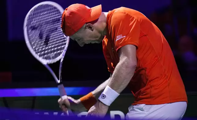 Netherlands' Tallon Griekspoor reacts as he plays Italy's Jannik Sinner during the Davis Cup final tennis match between Netherlands and Italy at the Martin Carpena Sports Hall in Malaga, southern Spain, Sunday, Nov. 24, 2024. (AP Photo/Manu Fernandez)