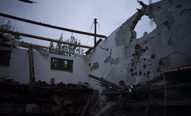 A damaged warehouse that was hit by a rocket fired from Lebanon two days before the start of the ceasefire between Israel and Hezbollah, stands in the Kibbutz Malkiya, northern Israel, Wednesday, Nov. 27, 2024. (AP Photo/Leo Correa)