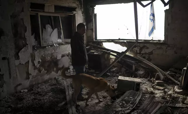 Naor Shamia, manager of the kibbutz emergency unit, stands at room of a house that was hit by a rocket fired from Lebanon, in the Kibbutz Manara, northern Israel, Thursday, Nov. 28, 2024. (AP Photo/Leo Correa)