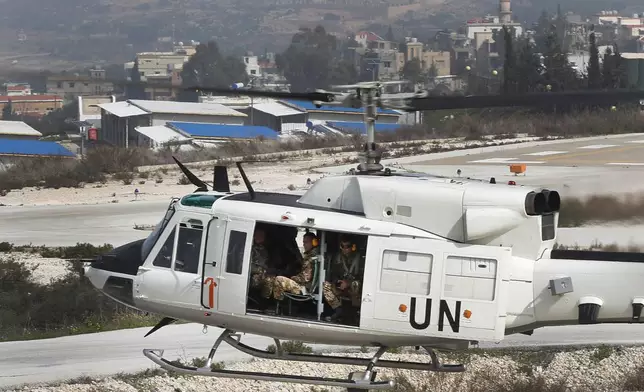 FILE - A United Nations helicopter carrying Italian peacekeepers takes off from the UNIFIL headquarters for a patrol over the Blue Line, a U.N.-drawn boundary between Lebanon and Israel, in the costal town of Naqoura, southern Lebanon, Wednesday, Feb. 7, 2018. (AP Photo/Hussein Malla, File)