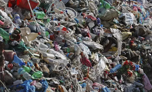 FILE - Garbage collected en route to Mount Everest is piled before it is sorted for recycling at a facility operated by Agni Ventures, an agency that manages recyclable waste, in Kathmandu, Nepal, June 24, 2024. (AP Photo/Sanjog Manandhar, File)