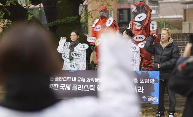 Environment activists shout slogans during a rally calling for a strong global plastics treaty ahead of the fifth session of the Intergovernmental Negotiating Committee on Plastic Pollution which set to be held in Busan from Nov. 25 to Dec. 1, in Seoul, South Korea, Wednesday, Nov. 20, 2024. (AP Photo/Lee Jin-man)