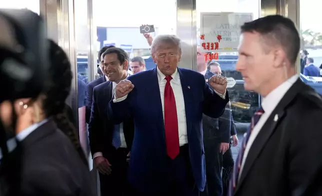 FILE - Republican presidential nominee former President Donald Trump, accompanied by Sen. Marco Rubio, R-Fla., arrives at the Havana Express Cuban Kitchen and Bakery on a campaign stop in Las Vegas, Oct. 24, 2024. (AP Photo/Alex Brandon, File)