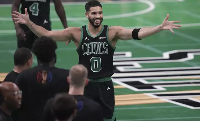 Boston Celtics forward Jayson Tatum (0) celebrates during the second half of an Emirates NBA Cup basketball game against the Cleveland Cavaliers, Tuesday, Nov. 19, 2024, in Boston. (AP Photo/Charles Krupa)