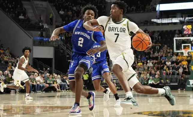 Baylor guard VJ Edgecombe (7) drives to the basket against New Orleans guard Jah Short (2) in the first half of an NCAA college basketball game Wednesday, Nov. 27, 2024, in Waco, Texas. (AP Photo/Tony Gutierrez)