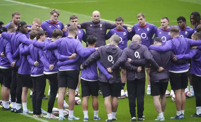 England head coach Steve Borthwick give a team talk during a team run at the Allianz Stadium, Twickenham, Friday, Nov. 8, 2024. (Adam Davy/PA via AP)