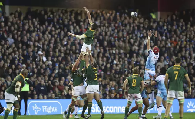 South Africa's Franco Mostert, fails to catch the ball as Scotland's Grant Gilchrist leaps to gather during the Autumn Nations series rugby union match between Scotland and South Africa in Edinburgh, Scotland, Sunday, Nov. 10, 2024. (AP Photo/Scott Heppell)