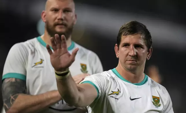 FILE - South Africa's Kwagga Smith, right, with teammate RG Snyman waves towards the supporters after a rugby test match between South Africa and Ireland at Kings Park stadium in Durban, South Africa, Saturday, July 13, 2024. (AP Photo/Themba Hadebe, File)