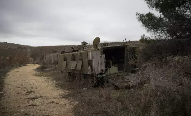 A damaged Israeli armoured personnel carrier (APC) stands on an area near the Israeli-Lebanese border, northern Israel, Wednesday, Nov. 27, 2024. (AP Photo/Leo Correa)