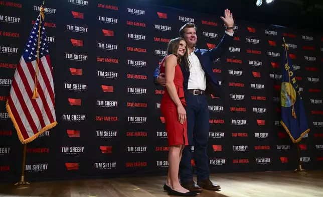 FILE - Republican Montana Senate candidate Tim Sheehy, right, waves to supporters with his wife, Carmen Sheehy, during an election night watch party, Nov. 6, 2024, in Bozeman, Mont. (AP Photo/Tommy Martino, File)