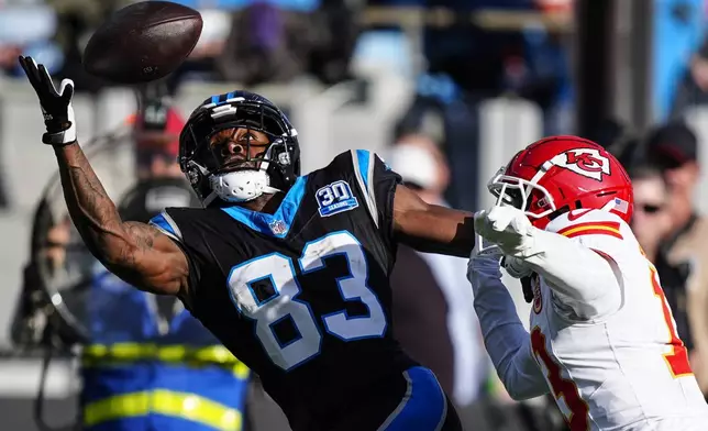 Carolina Panthers wide receiver David Moore (83) works for a catch against Kansas City Chiefs safety Nazeeh Johnson (13) during the second half of an NFL football game, Sunday, Nov. 24, 2024, in Charlotte, N.C. (AP Photo/Jacob Kupferman)