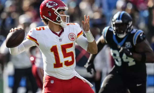 Kansas City Chiefs quarterback Patrick Mahomes (15) works in the pocket against the Carolina Panthers during the first half of an NFL football game, Sunday, Nov. 24, 2024, in Charlotte, N.C. (AP Photo/Rusty Jones)