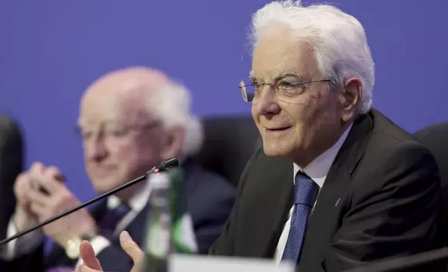 FILE - Sergio Mattarella, President of Italy, right, addresses journalists at the end of the Arraiolos Group meeting in Porto, Portugal, Oct. 6, 2023. (AP Photo/Miguel Angelo Pereira, File)