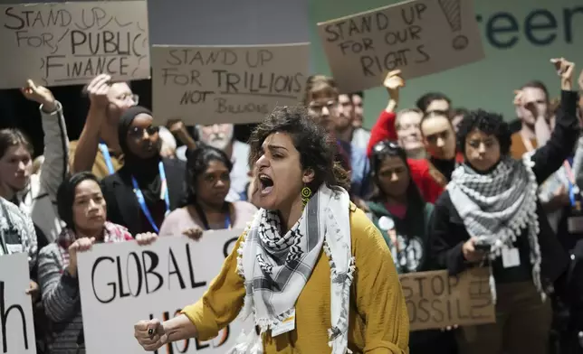 Activists participate in a demonstration for climate finance at the COP29 U.N. Climate Summit, Saturday, Nov. 23, 2024, in Baku, Azerbaijan. (AP Photo/Sergei Grits)