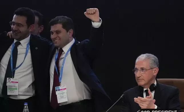 Mukhtar Babayev, COP29 President, applauds as he attends a closing plenary at the COP29 U.N. Climate Summit, Sunday, Nov. 24, 2024, in Baku, Azerbaijan. (AP Photo/Rafiq Maqbool)