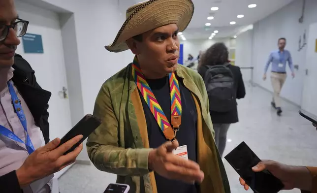 Panama Climate Envoy Juan Carlos Monterrey Gomez speaks to members of the media at the COP29 U.N. Climate Summit, Saturday, Nov. 23, 2024, in Baku, Azerbaijan. (AP Photo/Peter Dejong)