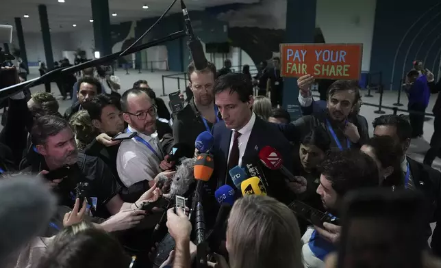 Wopke Hoekstra, EU climate commissioner, speaks to members of the media at the COP29 U.N. Climate Summit, Sunday, Nov. 24, 2024, in Baku, Azerbaijan. (AP Photo/Joshua A. Bickel)