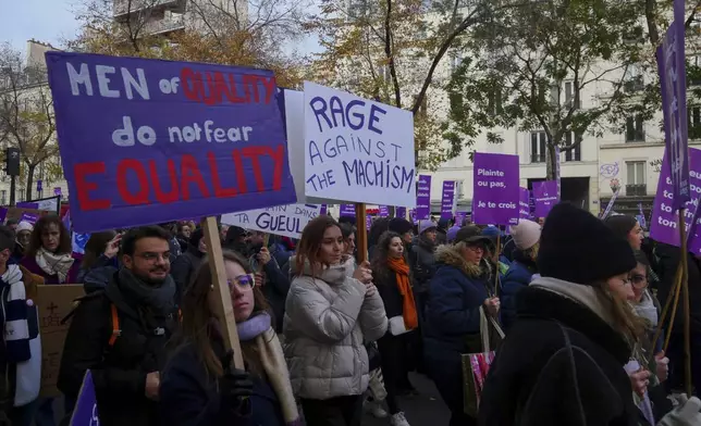 Protestors march during the International Day for the Elimination of Violence Against Women in Paris, France, Saturday, Nov. 23, 2024. (AP Photo/Thibault Camus)