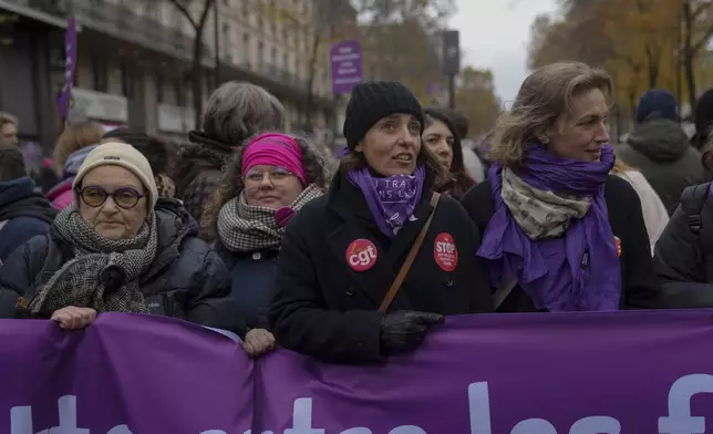 CGT union secretary general Sophie Binet, center, attends a march during the International Day for the Elimination of Violence Against Women in Paris, France, Saturday, Nov. 23, 2024. (AP Photo/Thibault Camus)