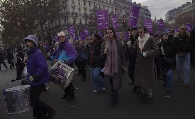 Protestors march during the International Day for the Elimination of Violence Against Women in Paris, France, Saturday, Nov. 23, 2024. (AP Photo/Thibault Camus)