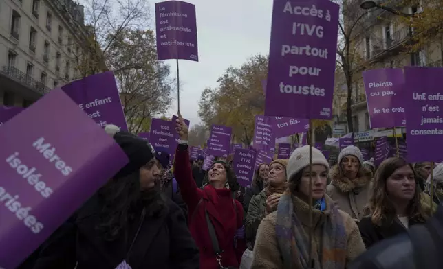 Protestors march during the International Day for the Elimination of Violence Against Women in Paris, France, Saturday, Nov. 23, 2024. (AP Photo/Thibault Camus)