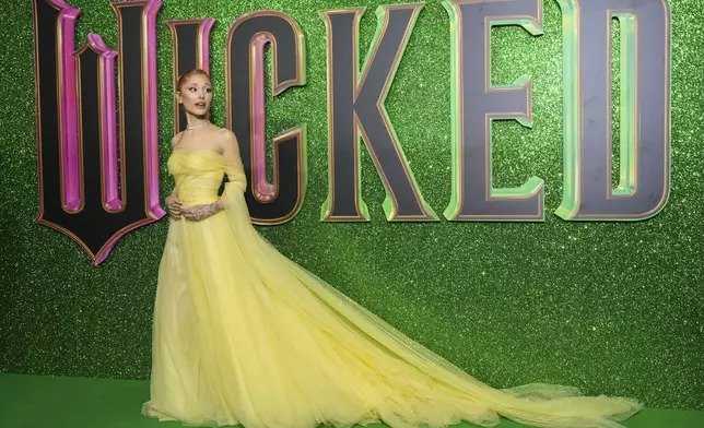 Ariana Grande poses for photographers upon arrival at the premiere of the film 'Wicked' on Monday, Nov. 18, 2024, in London. (Photo by Scott A Garfitt/Invision/AP)