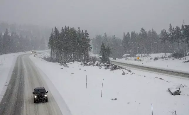 Motorists negotiate the snow along I-80 during a storm Wednesday, Nov. 20, 2024, in Truckee, Calif. (AP Photo/Brooke Hess-Homeier)