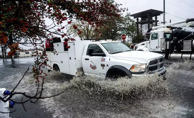 A truck crosses a flooded road Wednesday, Nov. 20, 2024, in Santa Rosa, Calif. (AP Photo/Noah Berger)