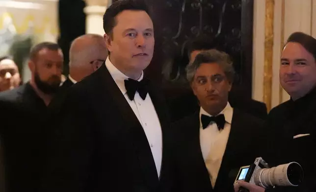 Elon Musk arrives before President-elect Donald Trump speaks during an America First Policy Institute gala at his Mar-a-Lago estate, Thursday, Nov. 14, 2024, in Palm Beach, Fla. (AP Photo/Alex Brandon)