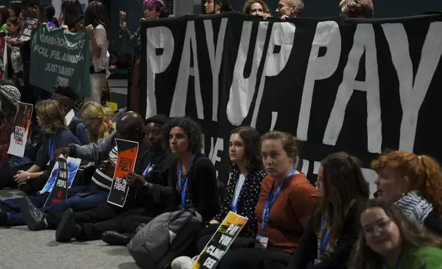 Activists participate in a demonstration for climate finance at the COP29 U.N. Climate Summit, Saturday, Nov. 16, 2024, in Baku, Azerbaijan. (AP Photo/Peter Dejong)