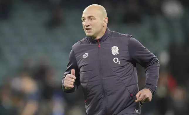 England's head coach Steve Borthwick walks on the pitch to watch his players during the warm-up ahead of the Autumn Nations series rugby union match between England and South Africa, at Twickenham, in London, Saturday, Nov. 16, 2024. (AP Photo/Kin Cheung)