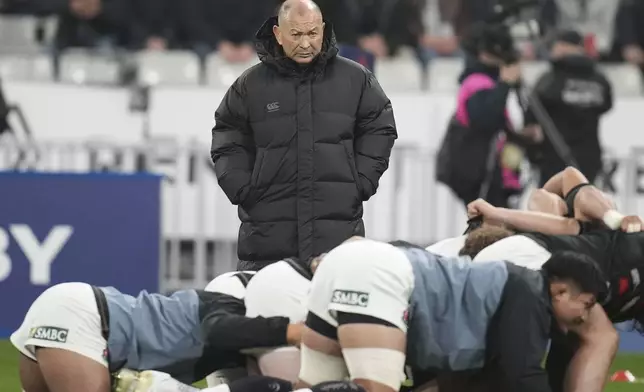 Japan's Eddie Jones watches his players warm-up before the Autumn Nations series rugby union match between France and Japan at the Stade de France in Saint-Denis, outside Paris, Saturday, Nov. 9, 2024. (AP Photo/Christophe Ena)